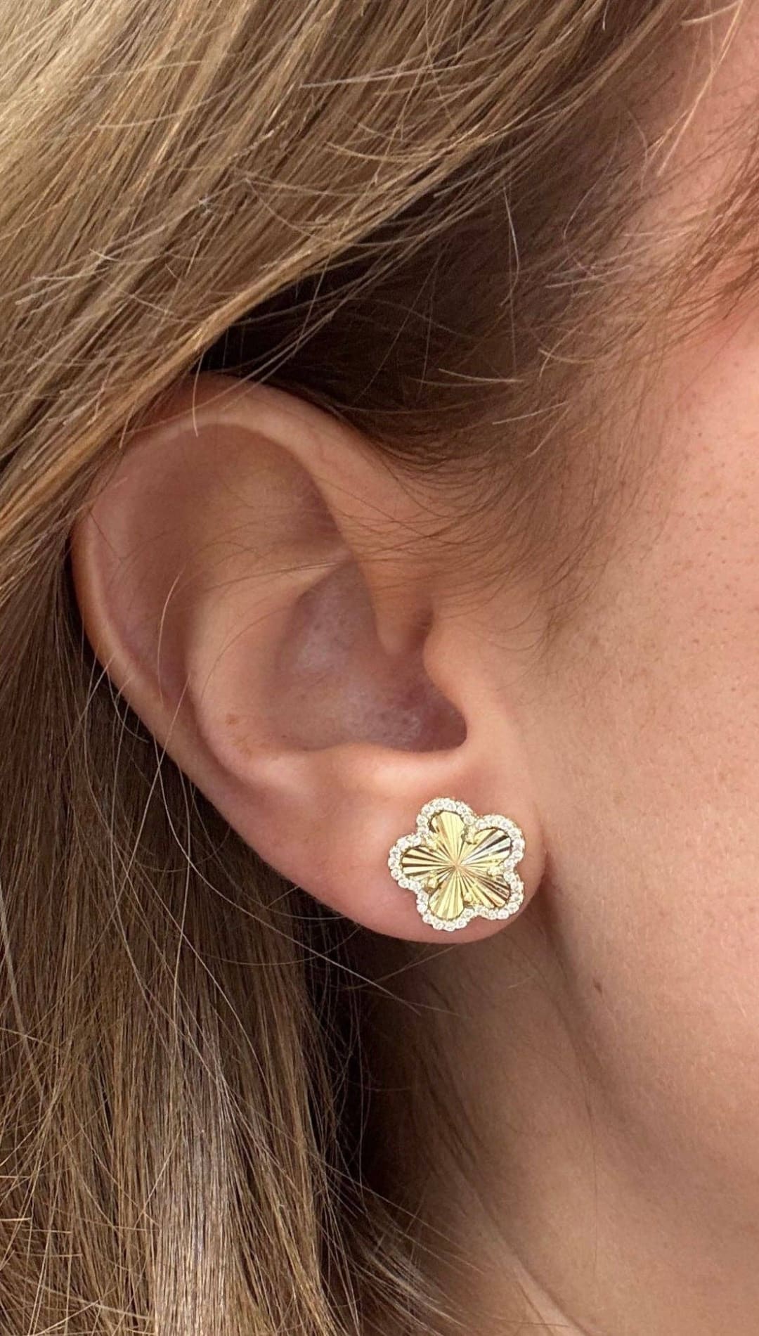 Gold flower earring.