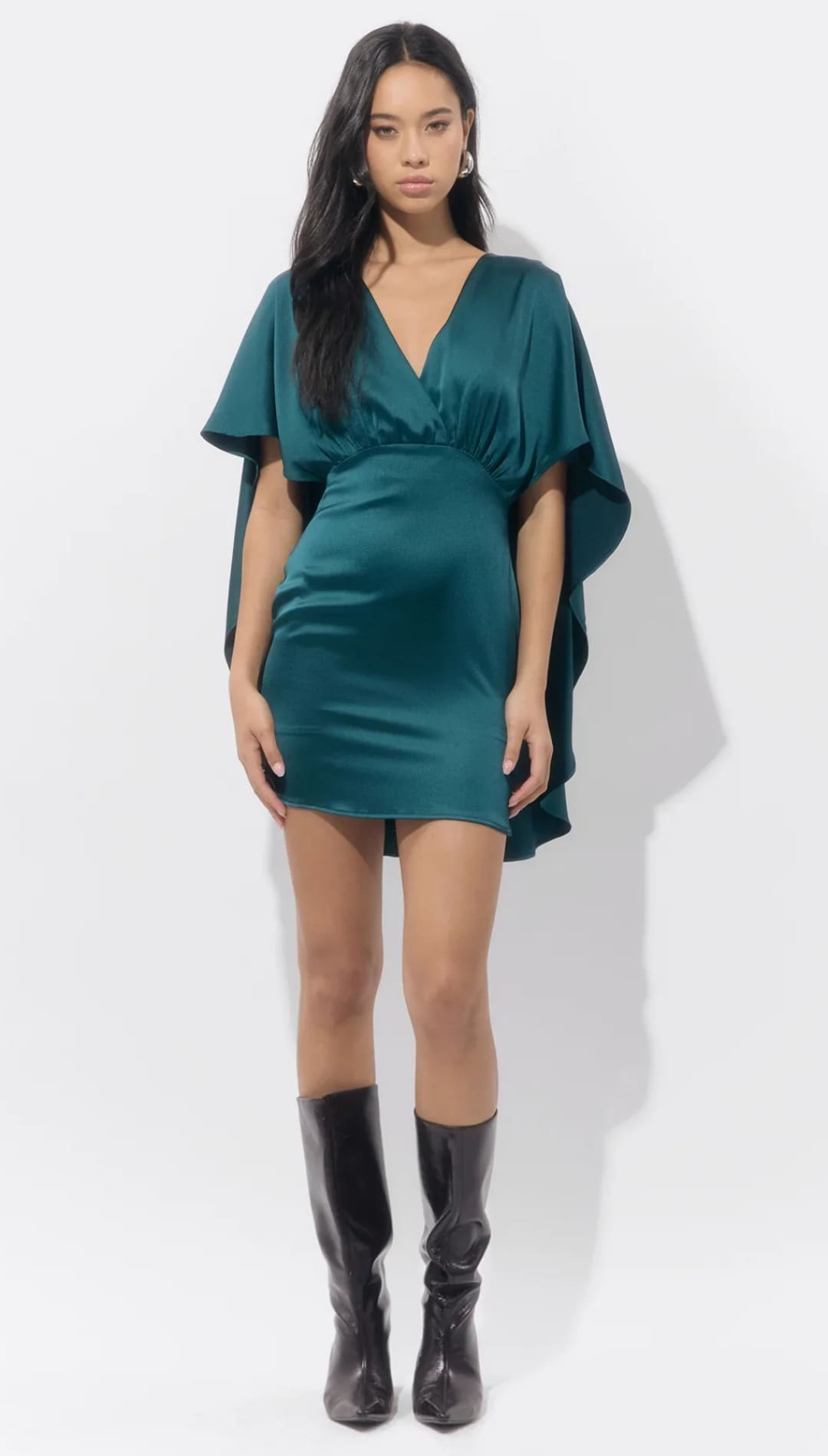 Emerald green satin mini dress with ruffled sleeves and a deep v-neckline.
