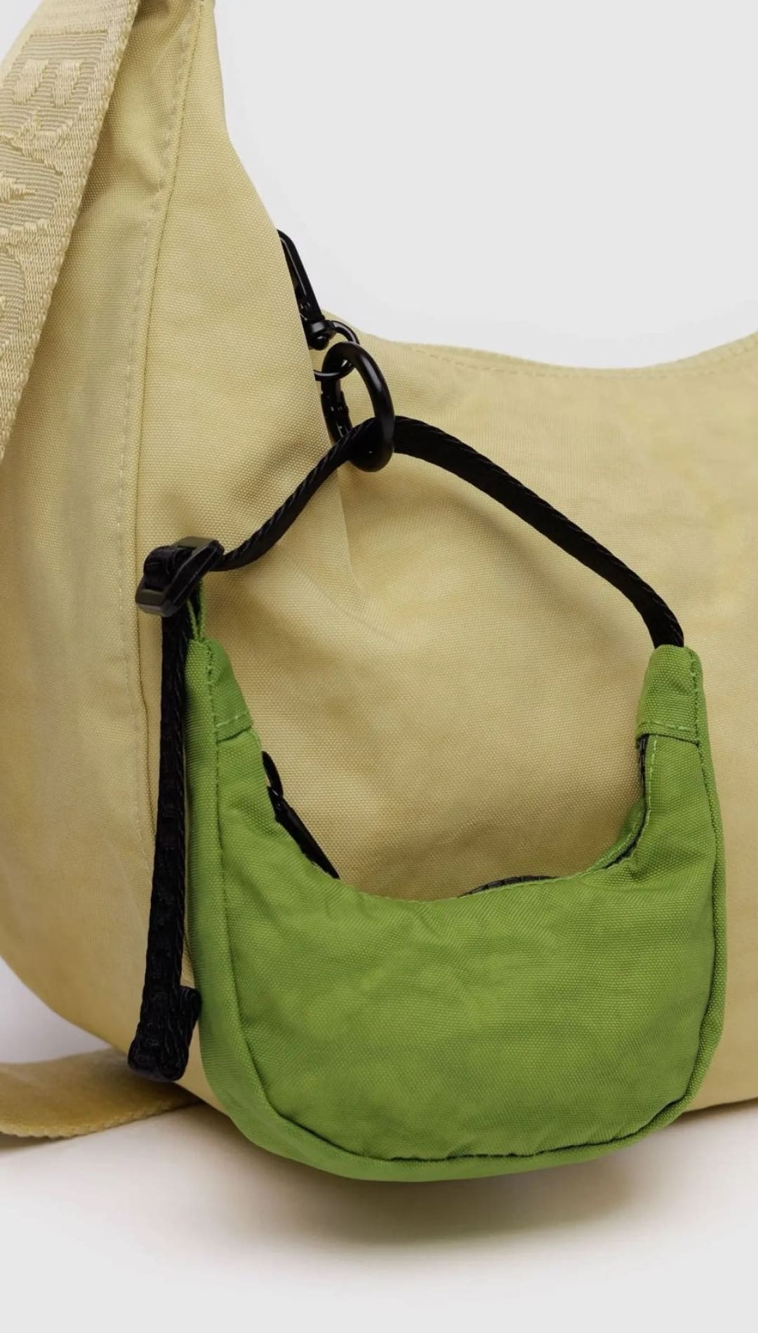 Beige hobo bag with green mini-purse.