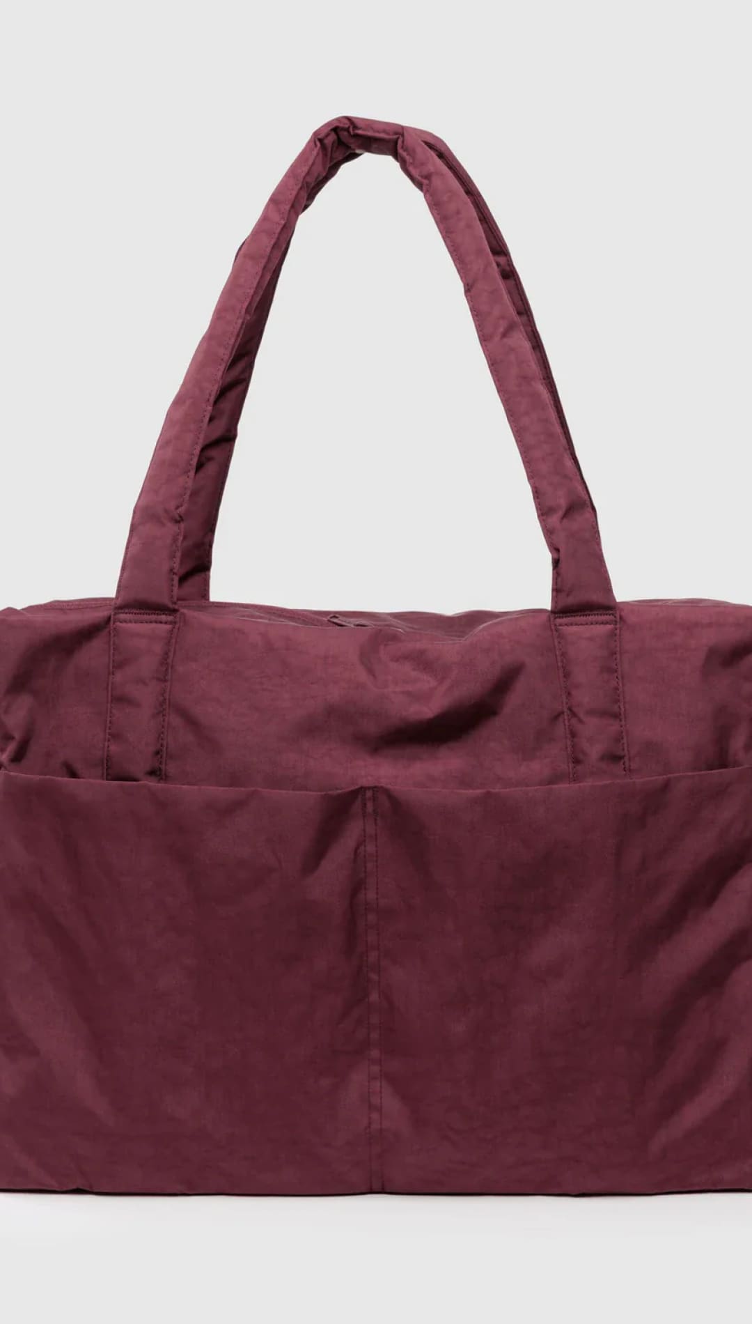 Maroon tote bag with two exterior pockets and a drawstring closure.