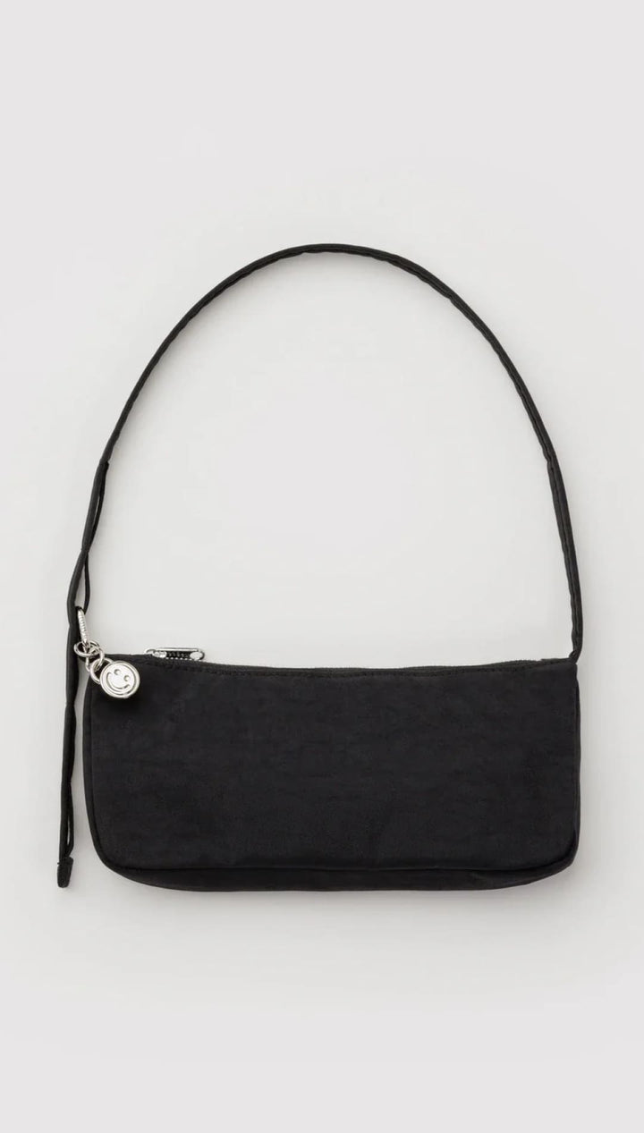 Black minimalist shoulder bag with silver hardware and adjustable strap.