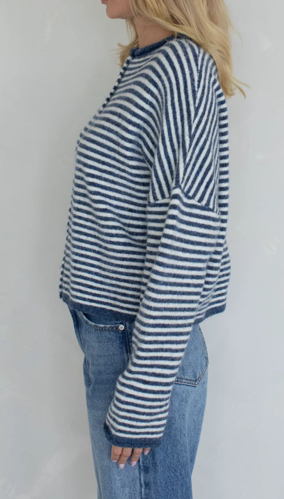 Striped sweater with navy and white stripes, made of soft cotton.