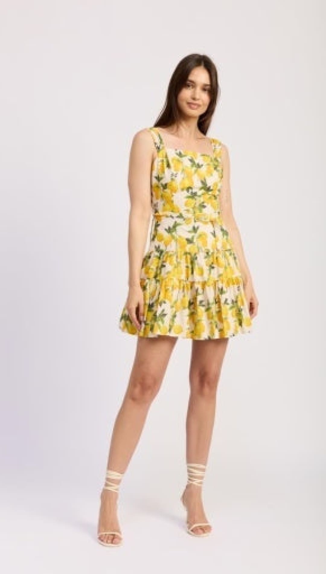 Woman in a yellow lemon-print dress.