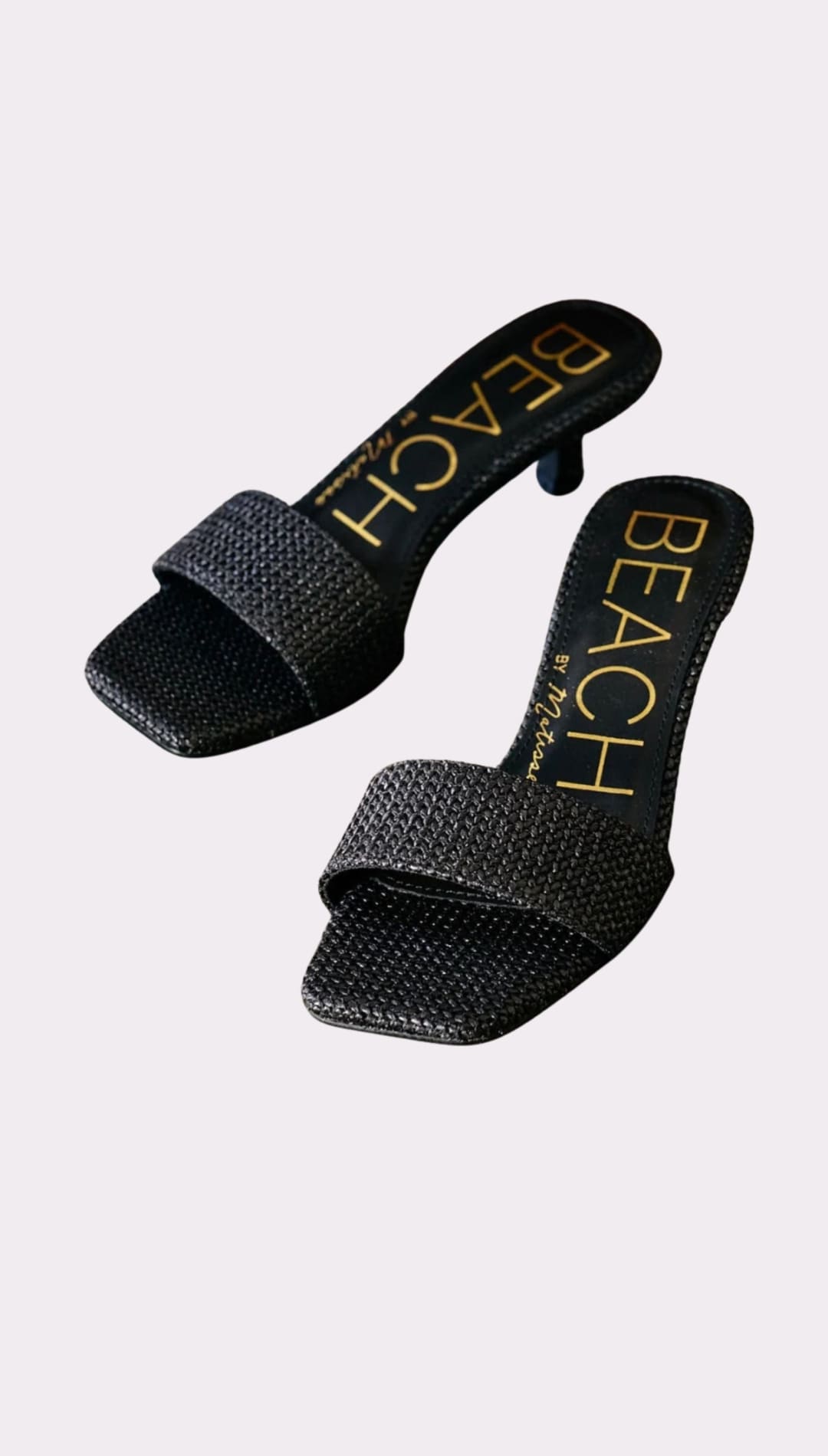 Black woven heeled sandals.