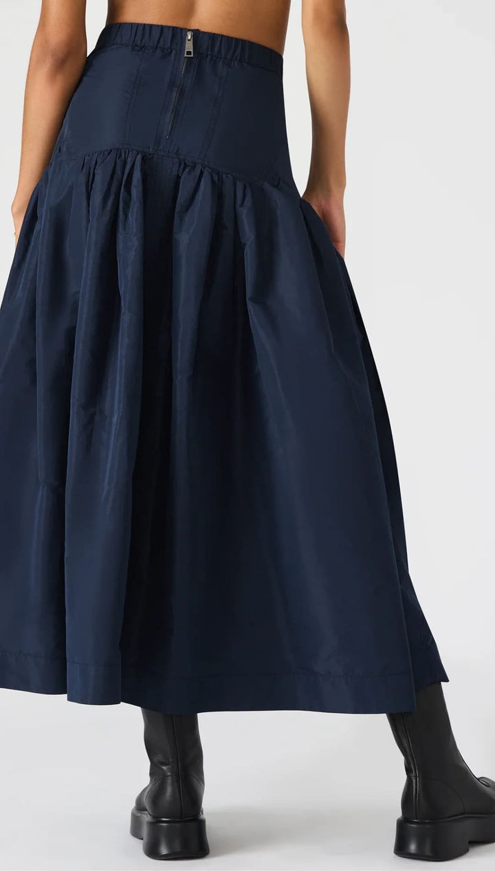 Navy blue high-waisted tiered maxi skirt with a back zipper closure.