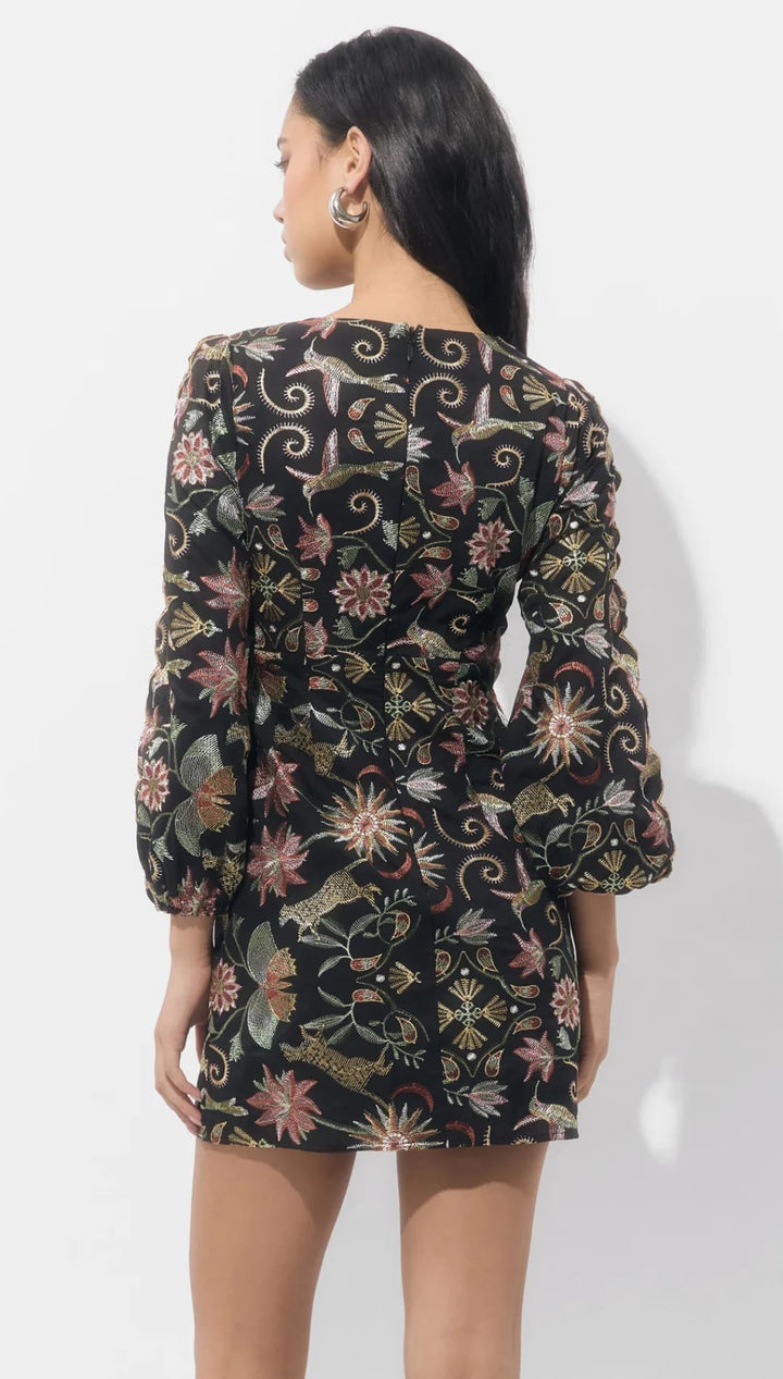 Black floral print mini dress with long sleeves and a v-neckline.