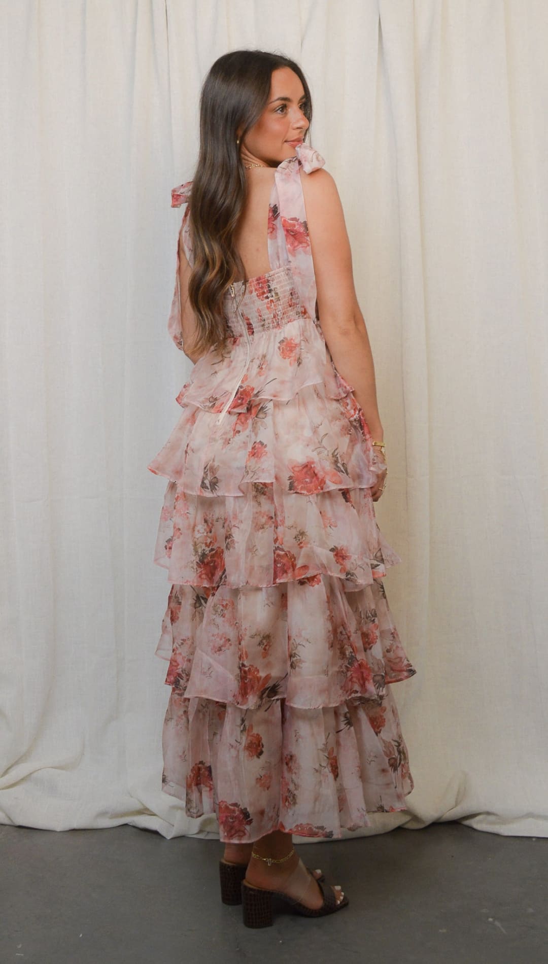 Floral-patterned, tiered, ruffled dress.