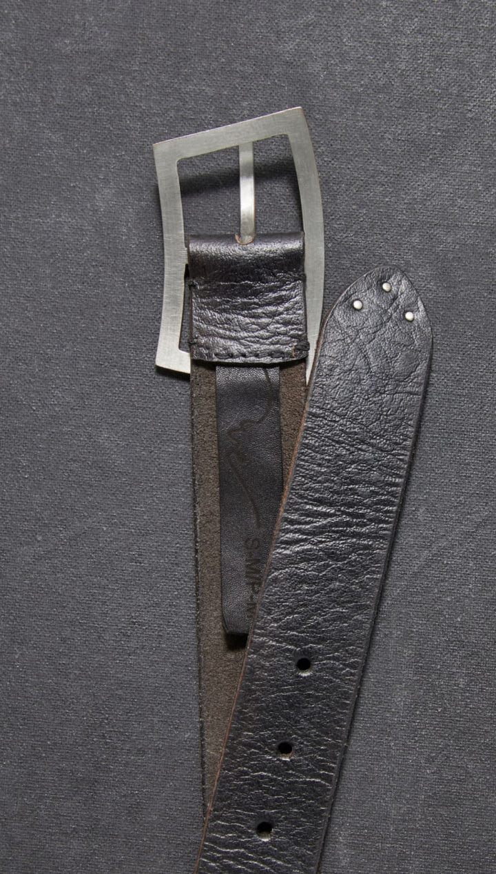 Black leather belt with silver buckle.