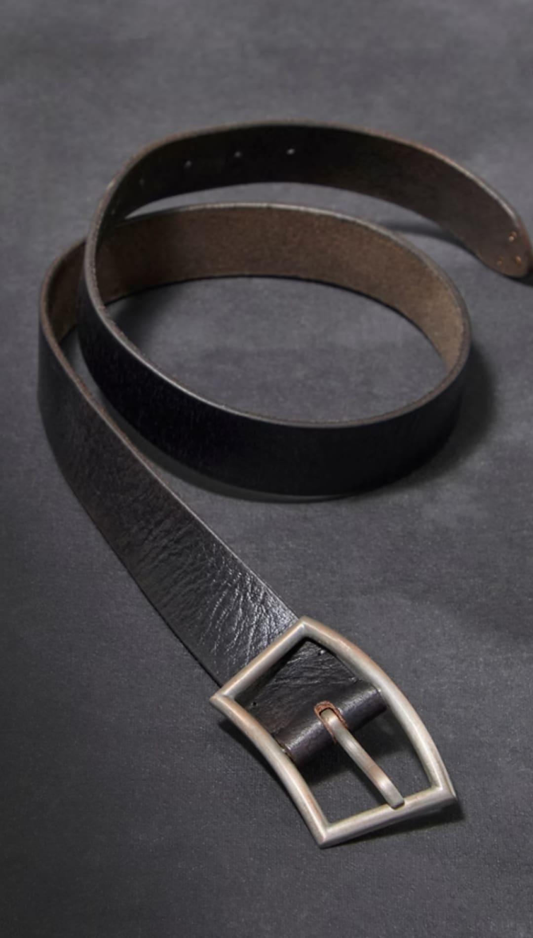 Black leather belt with silver buckle.