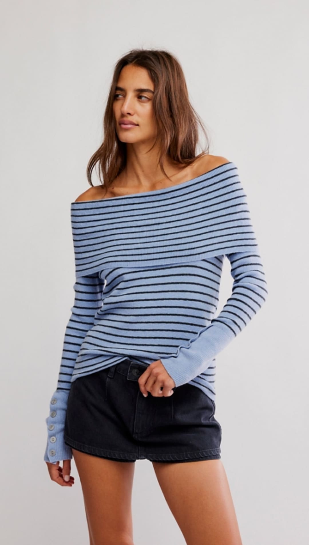 Blue and black striped off-the-shoulder sweater.