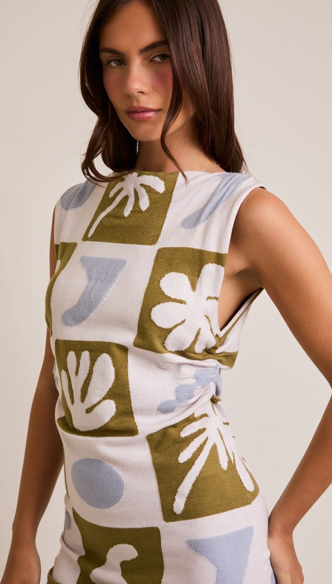 Sleeveless dress with geometric floral pattern.