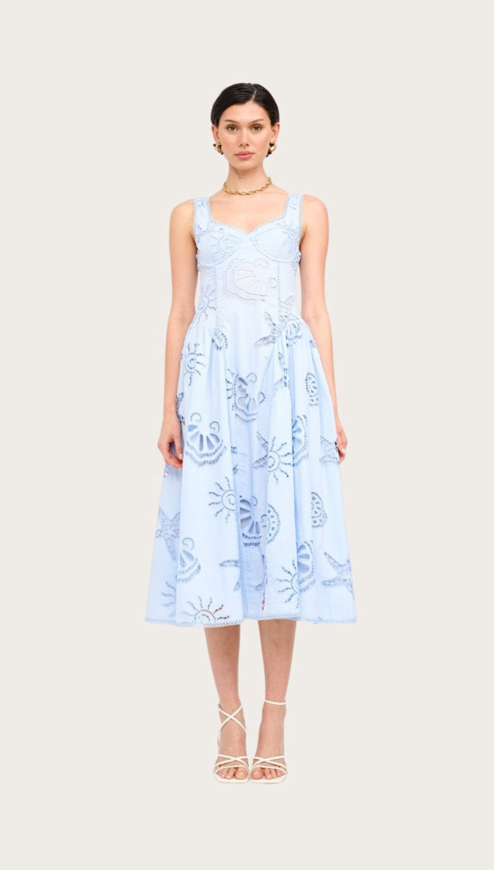 Light blue sundress with nautical motifs.