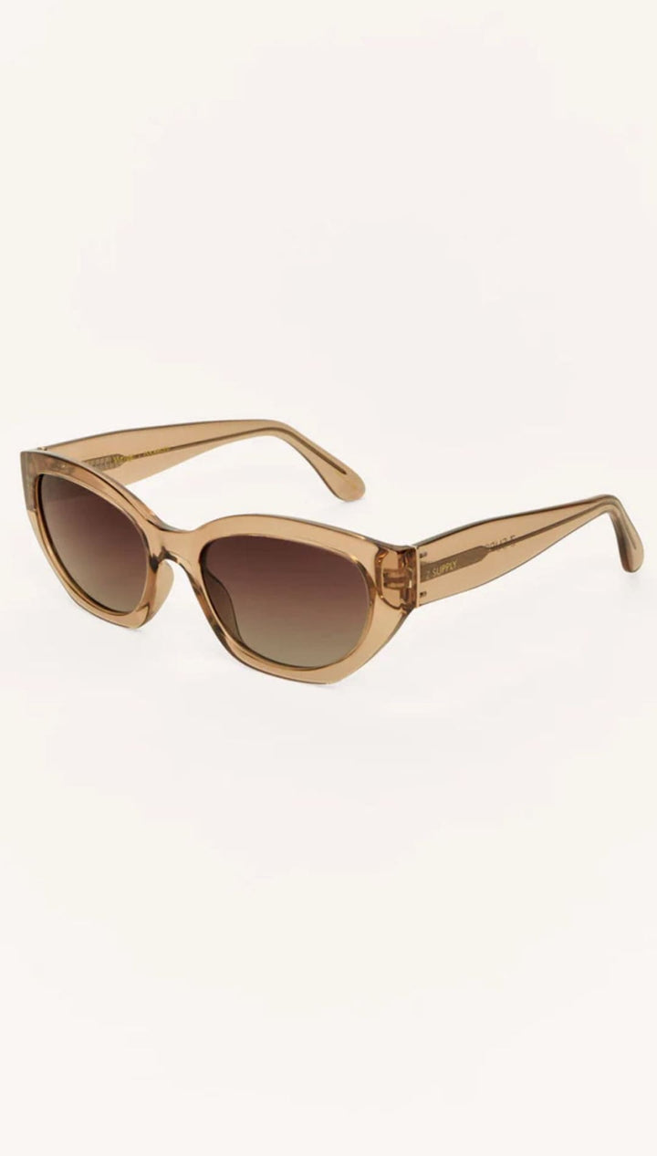 Brown-tinted cat-eye sunglasses.