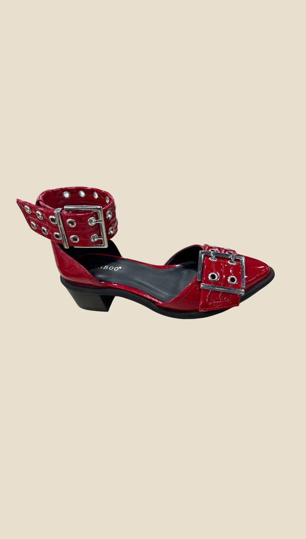 Red patent leather Mary Jane-style flats with multiple silver buckles and eyelets.