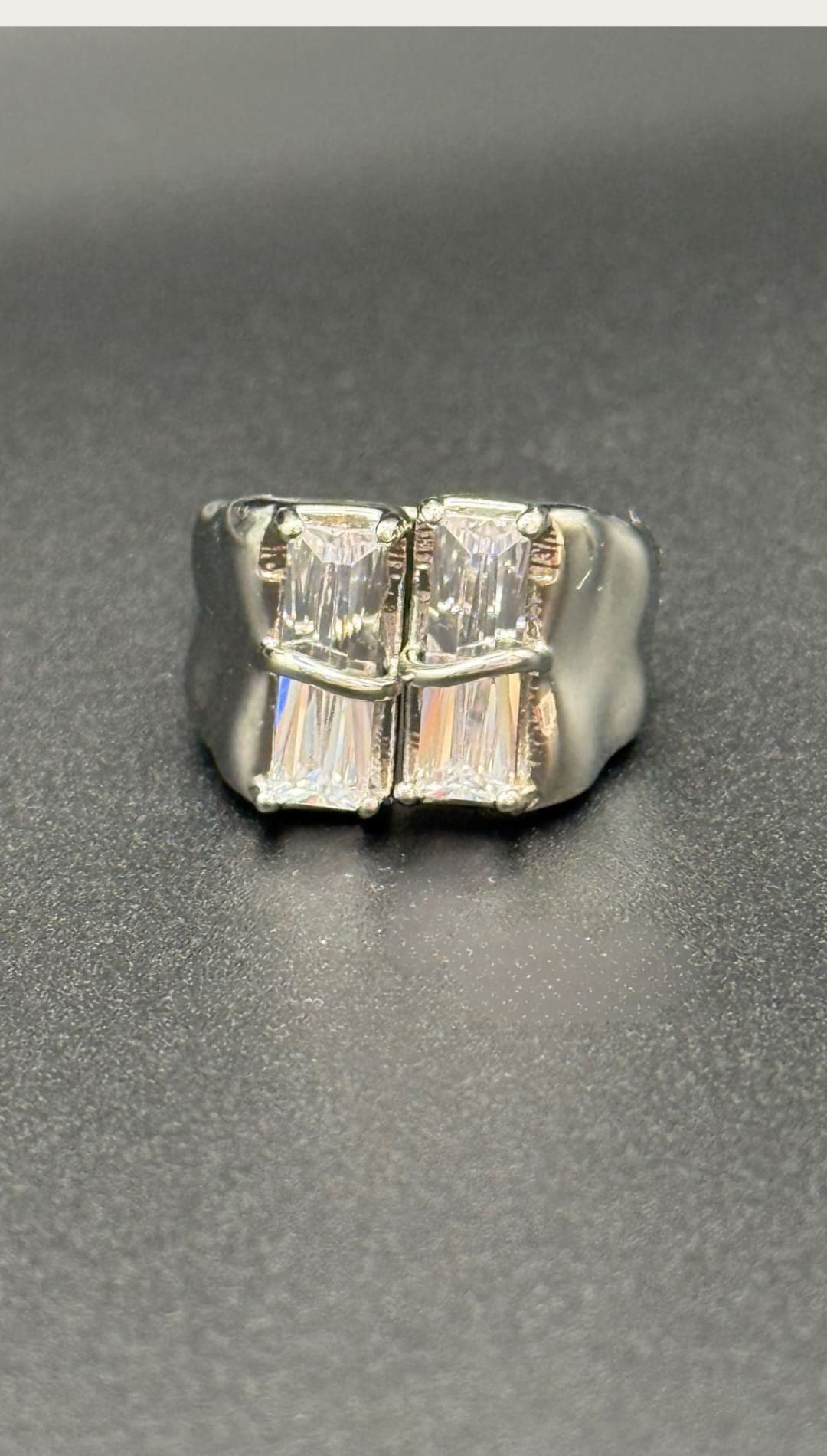 Silver ring with rectangular crystals.