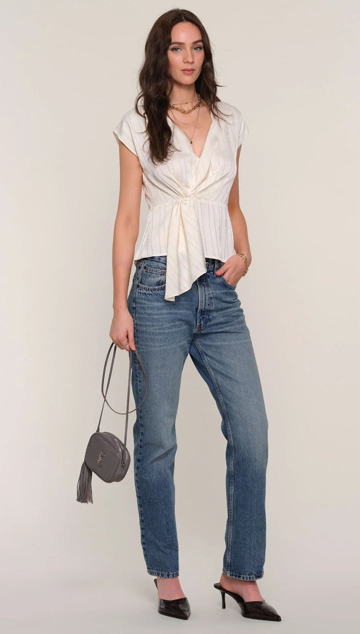 Women’s cream-colored short-sleeved top with a v-neck and a knotted front design.