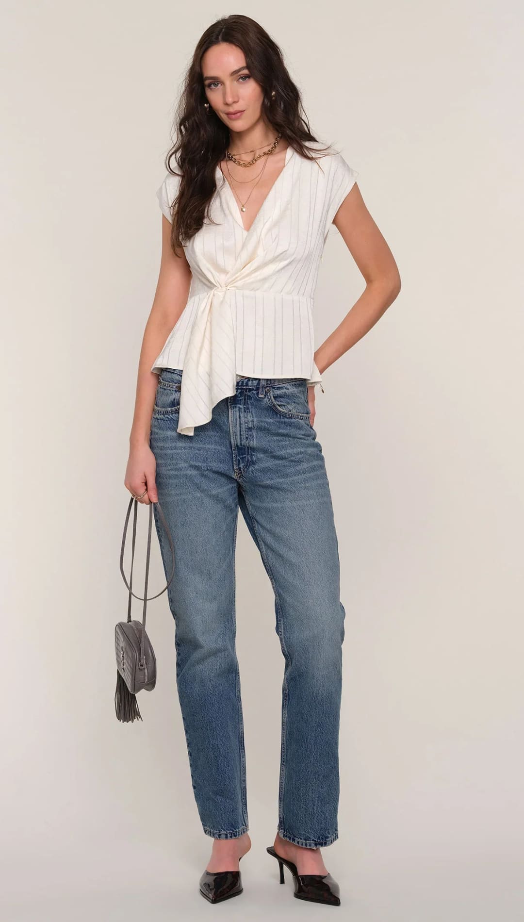 Women’s white draped peplum blouse.