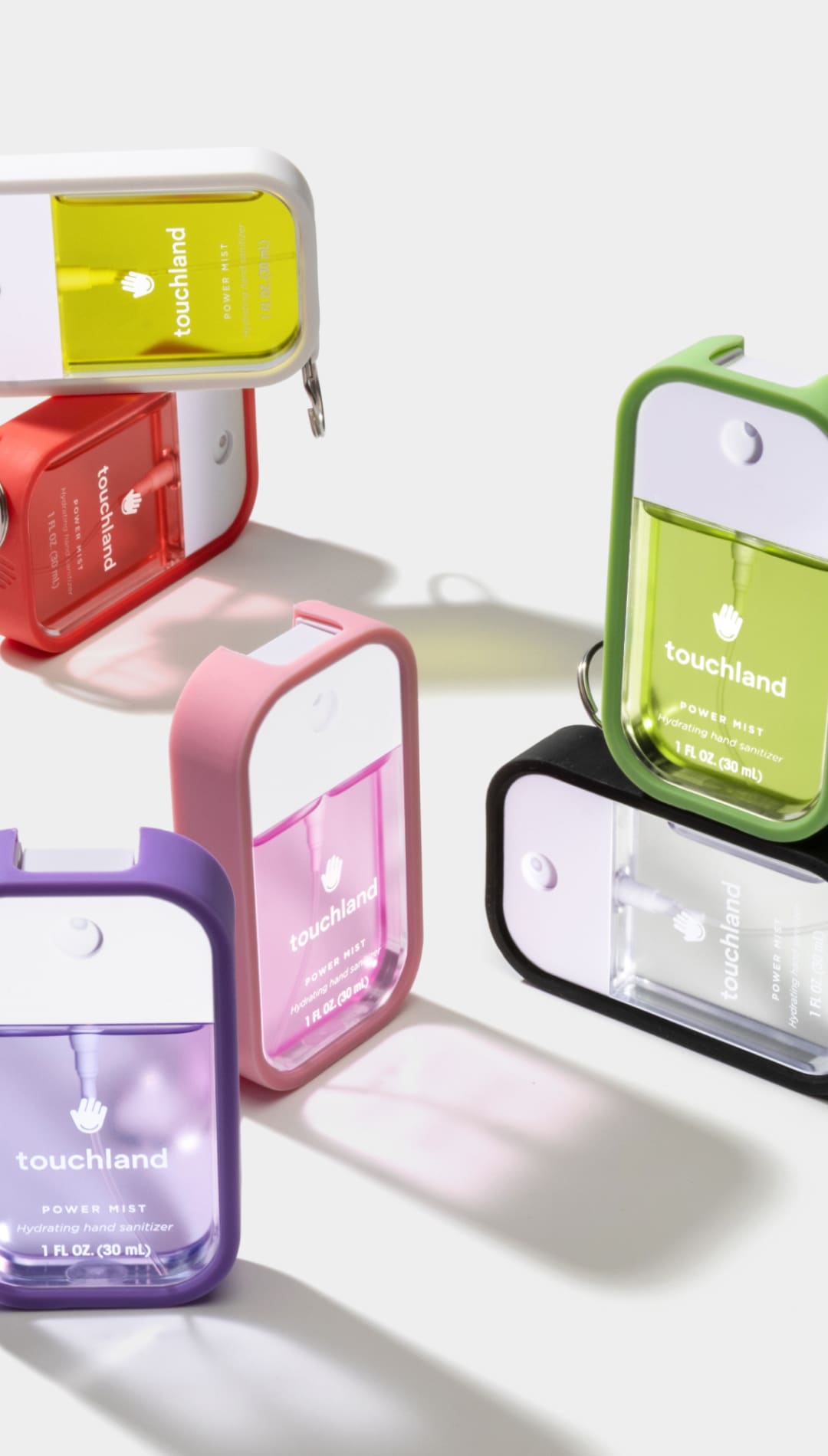 Touchhand keychain hand sanitizer in various vibrant colors with clear plastic case and compact size.