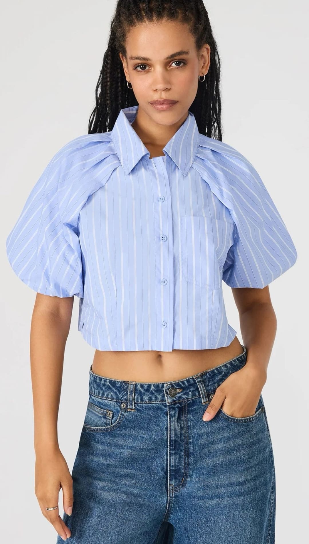 Cropped blue striped puff-sleeve blouse.