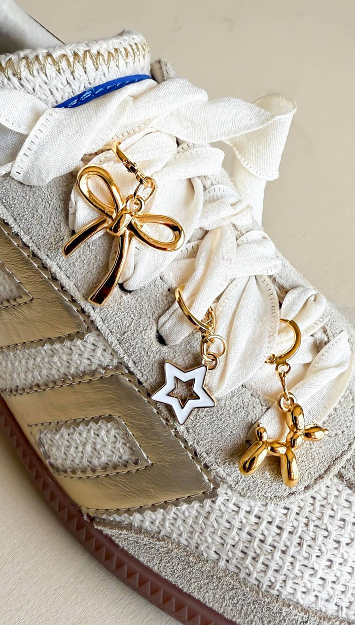 Decorated sneaker with charms.