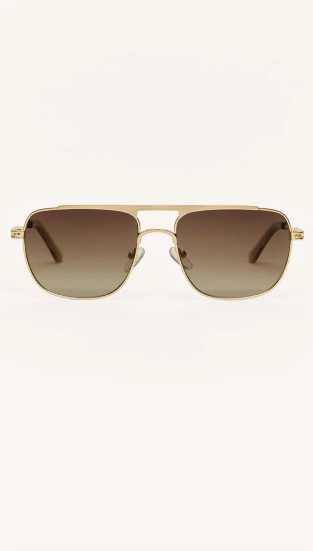 Gold-framed aviator sunglasses with brown gradient lenses.
