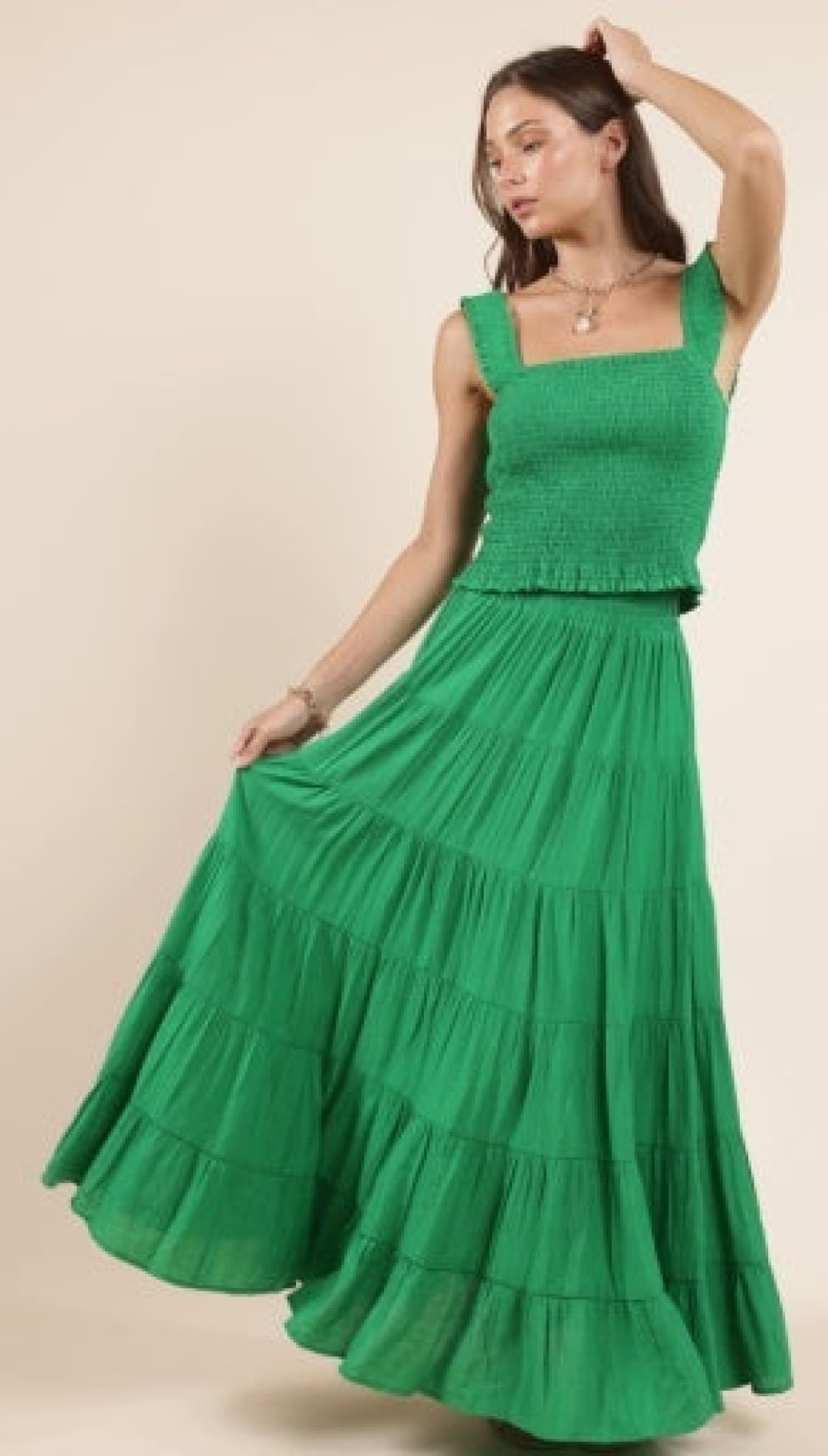 Green smocked top and tiered skirt set.