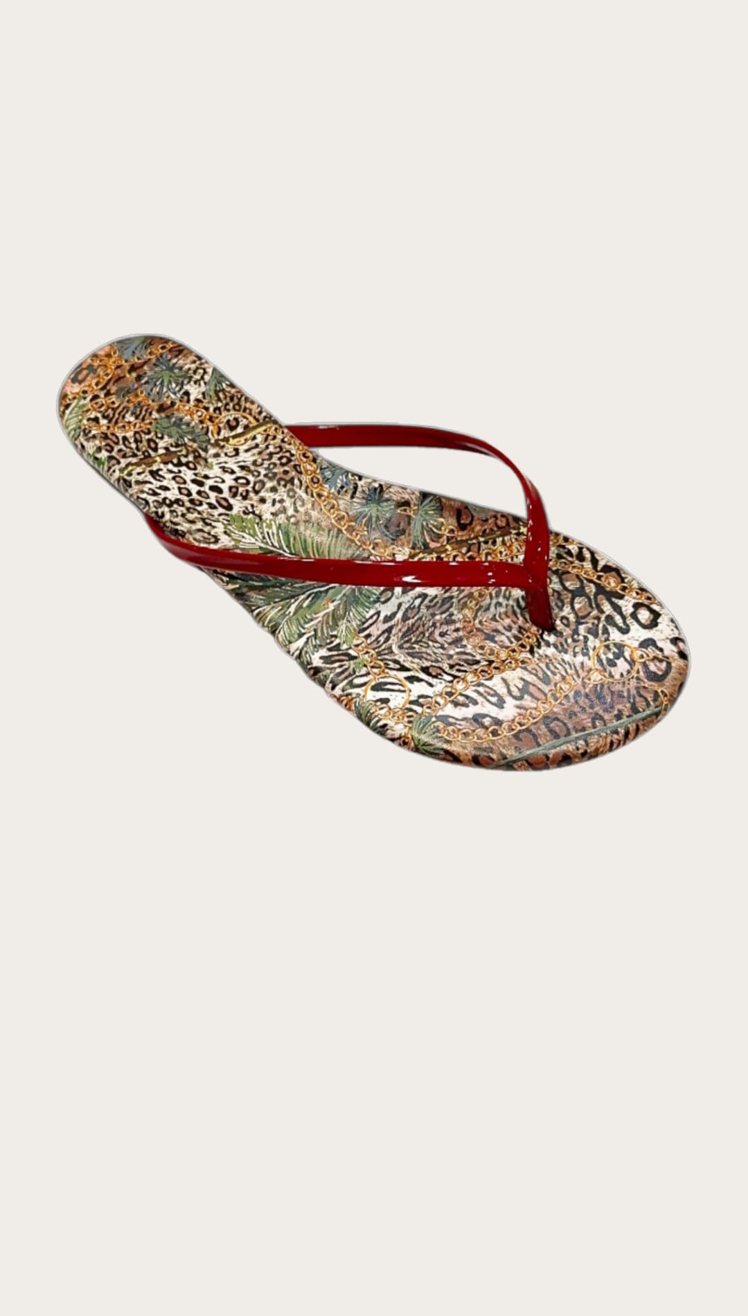 Animal-print flip-flop with red straps.