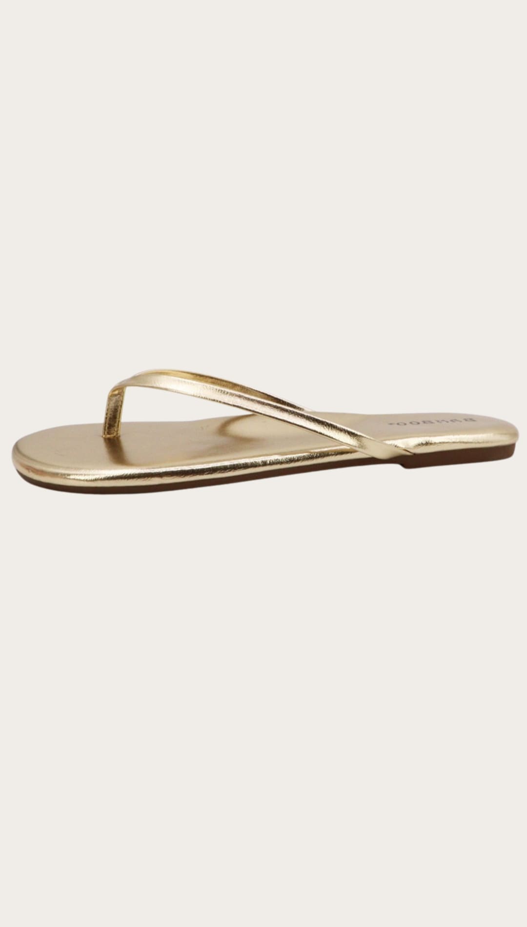 Gold-colored flip-flop sandal.