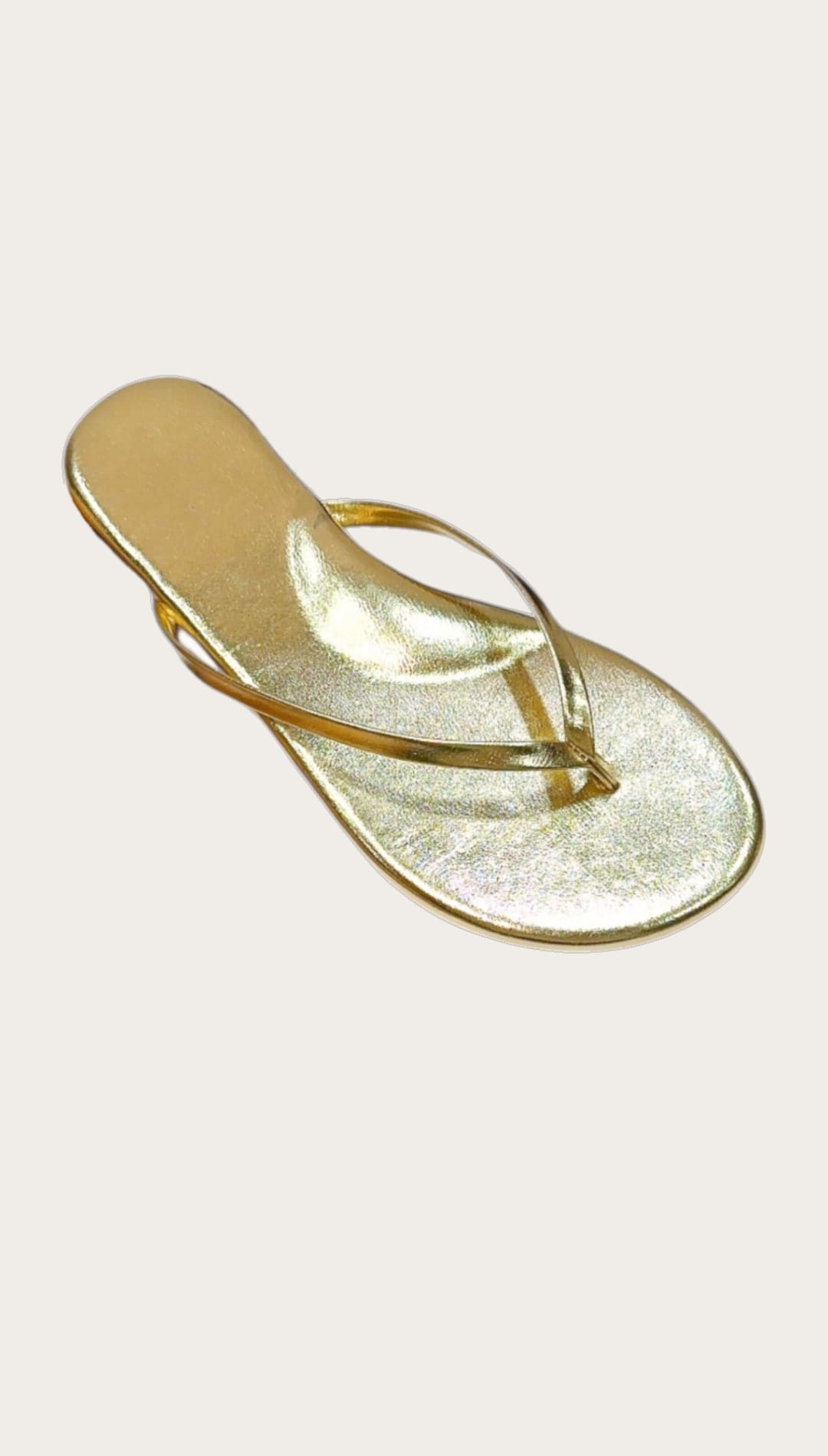 Gold-colored flip-flop sandal.