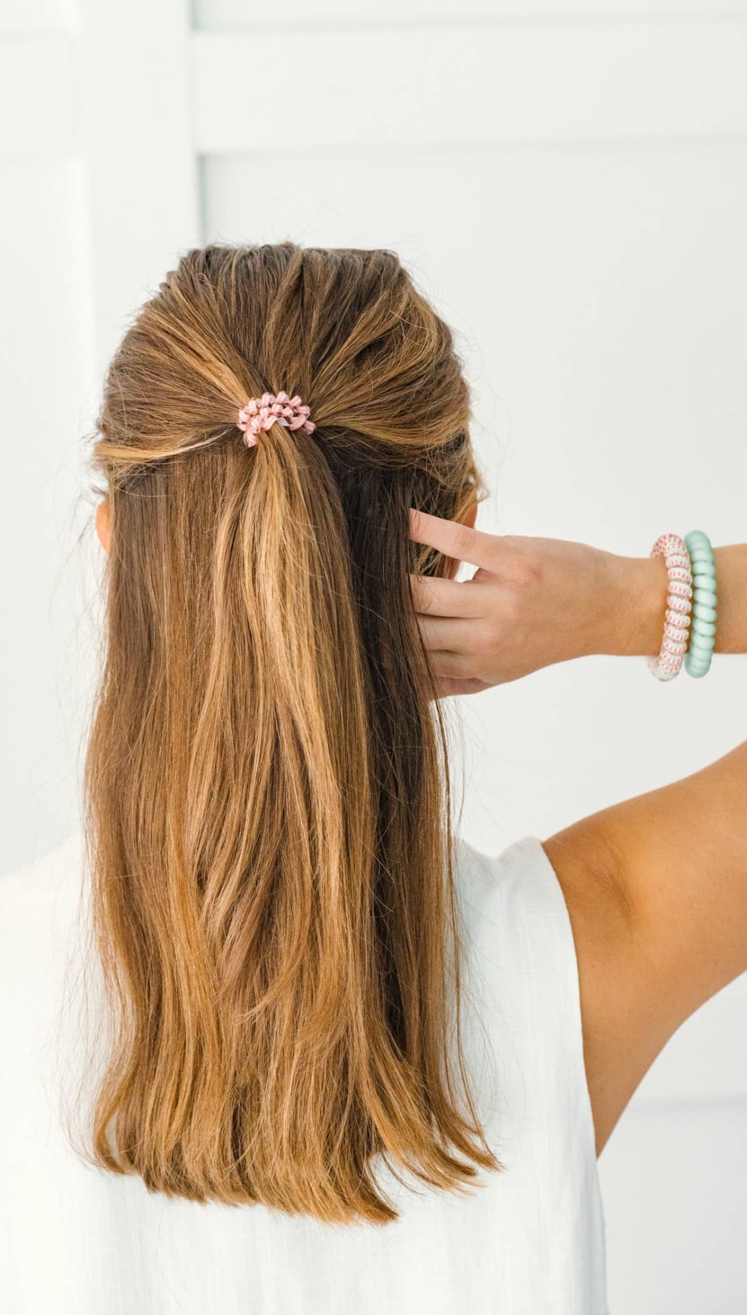 Rose gold floral hair clip with pearl accents, delicate and elegant design.