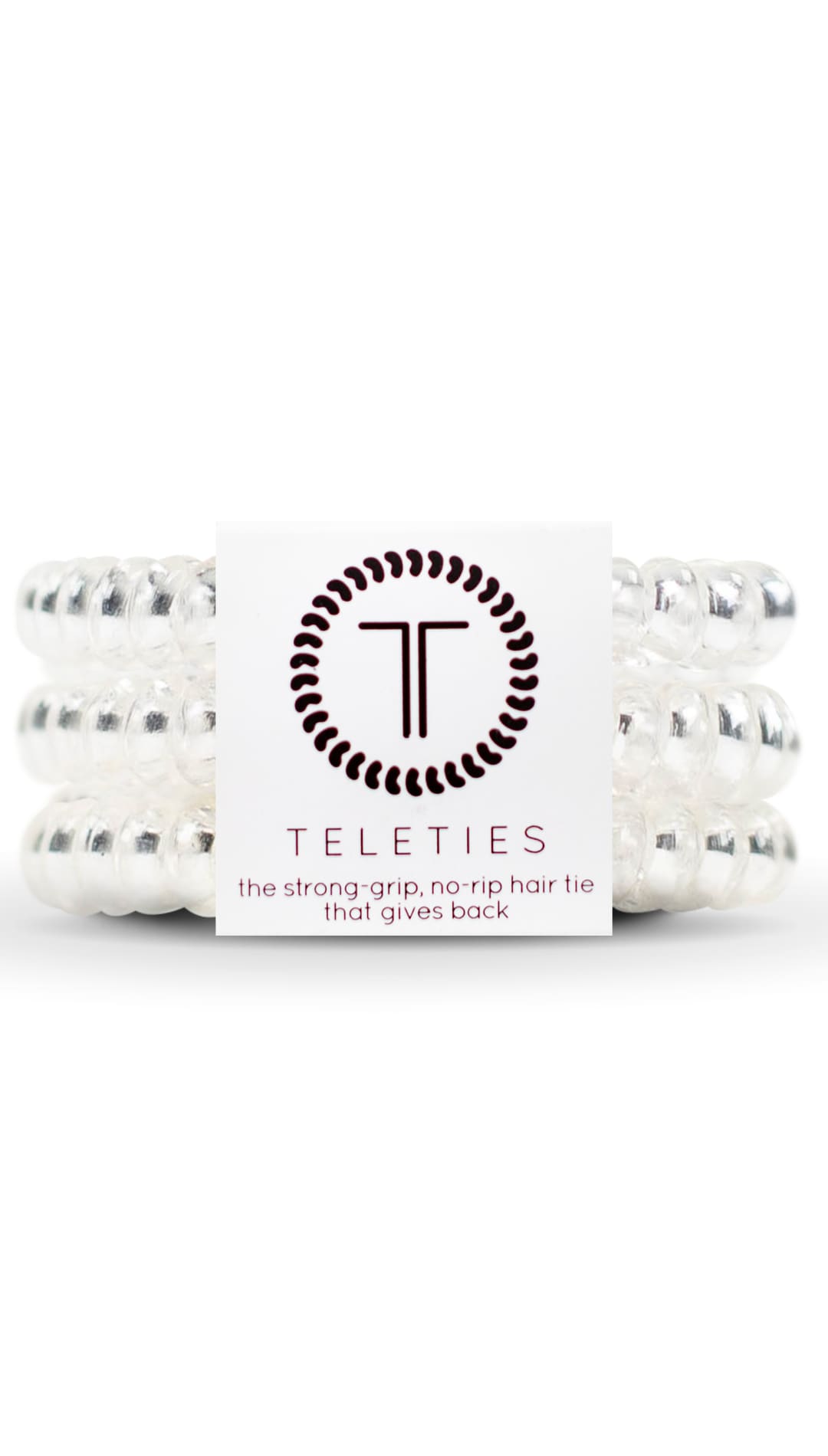 White teleties hair ties with black and silver accents, made of elastic material.