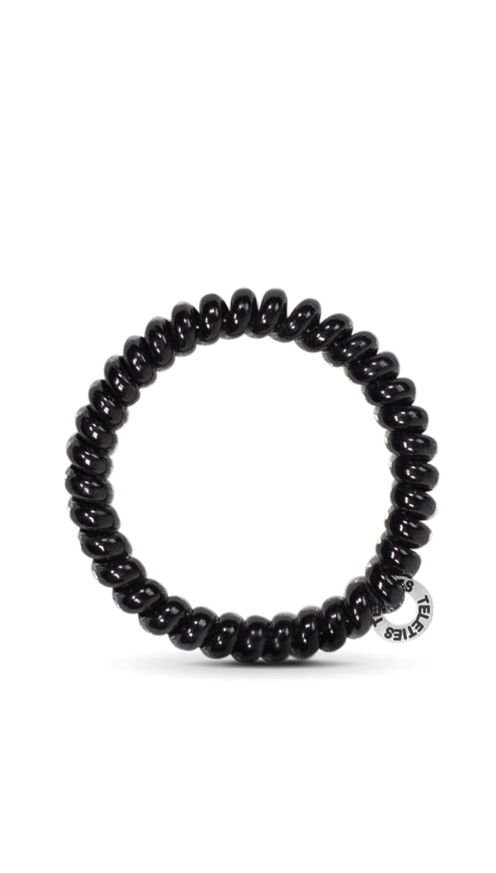 Black beaded bracelet with silver accents and a small logo.