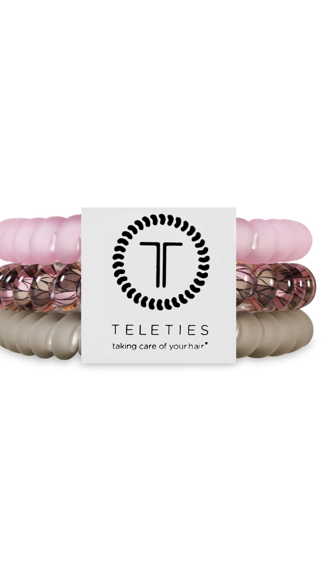 Rose gold and white beaded hair ties with a circular logo featuring ’teleties’ branding.
