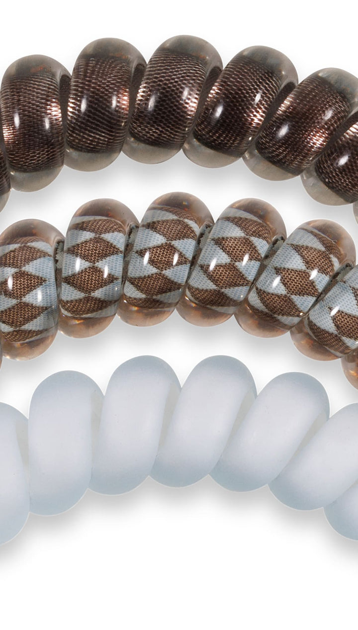 Brown and white beaded bracelet with geometric pattern, likely made of glass or ceramic beads.