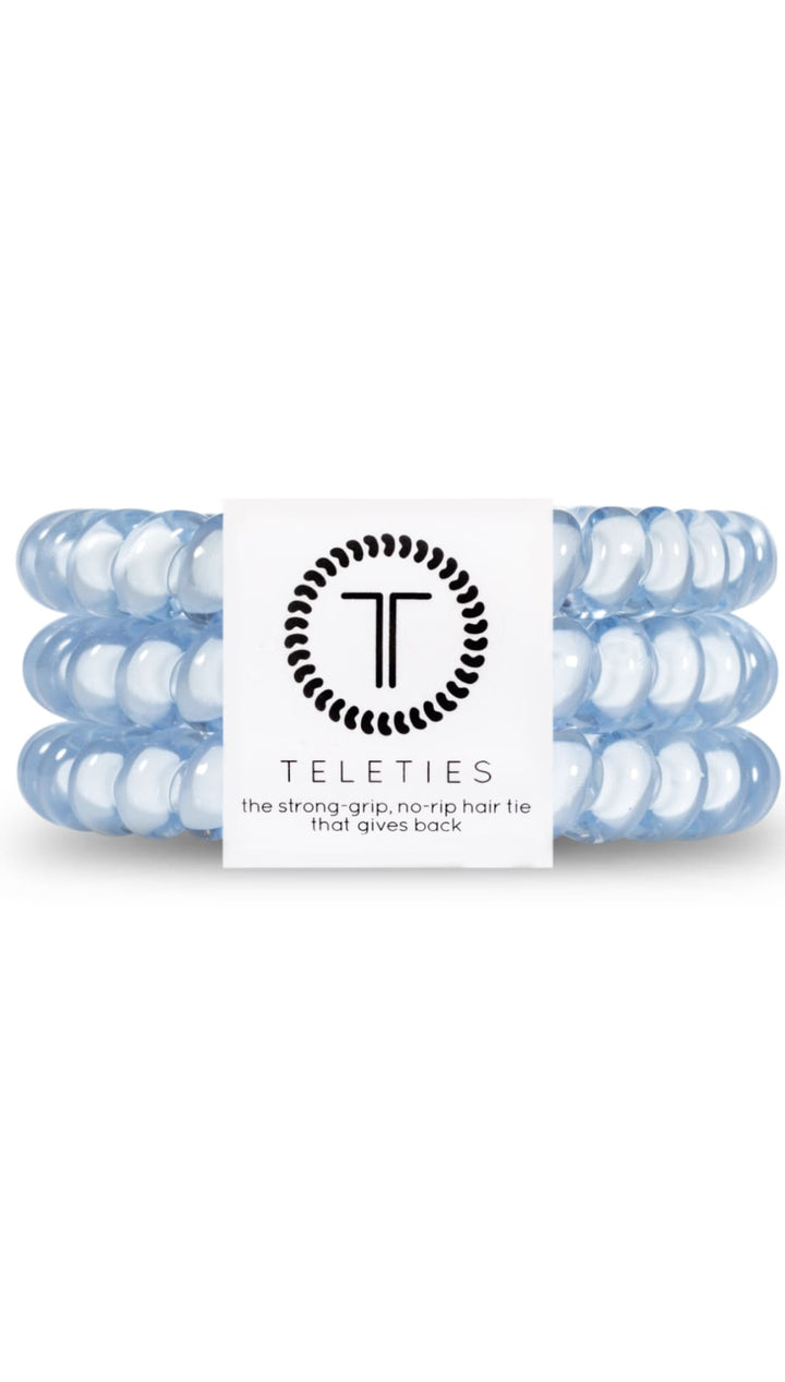 Blue and white braided hair ties with a circular logo.