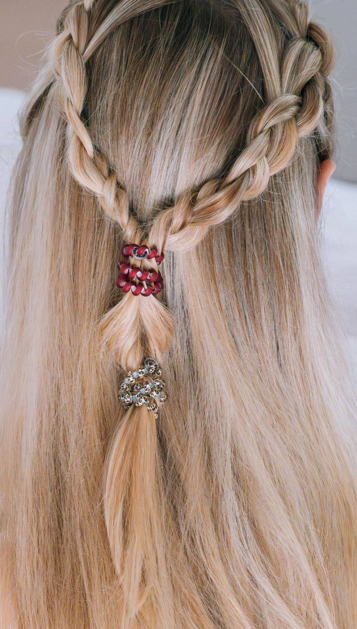 Braided hair with red and gold beads