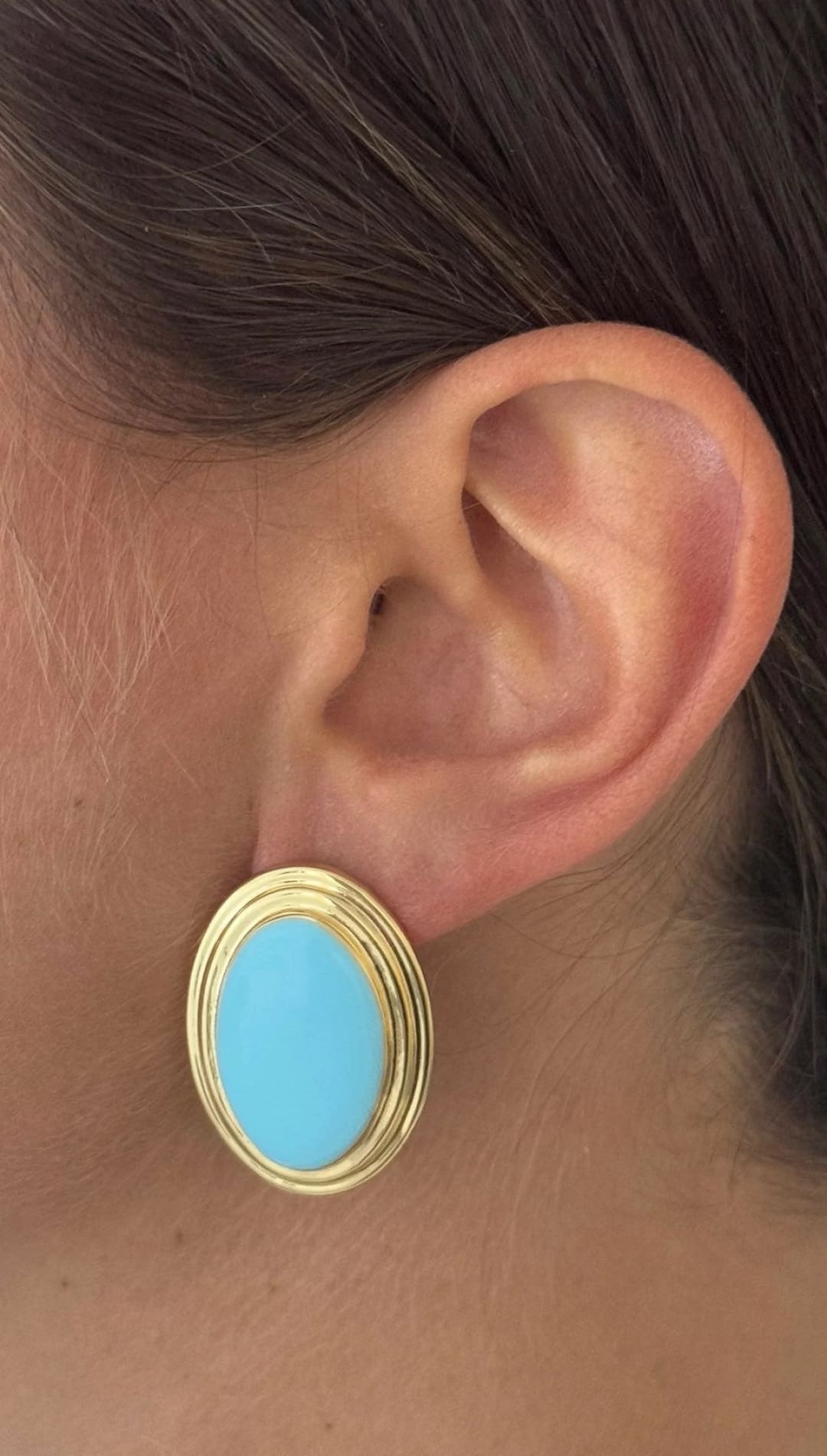 Oval turquoise and gold earrings.
