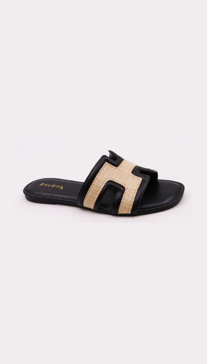 Black and beige slide sandal.