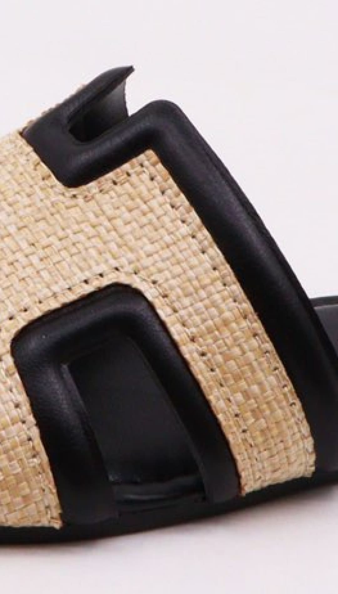 Black and tan slide sandal.