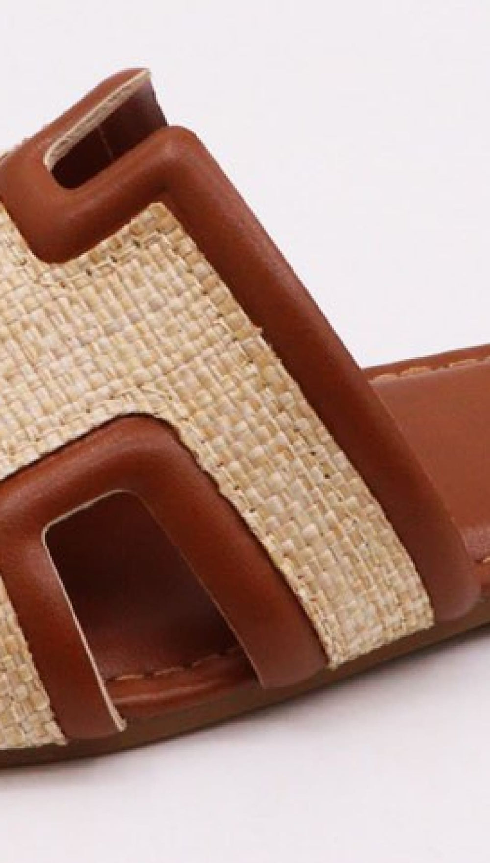 Brown and beige slide sandal.