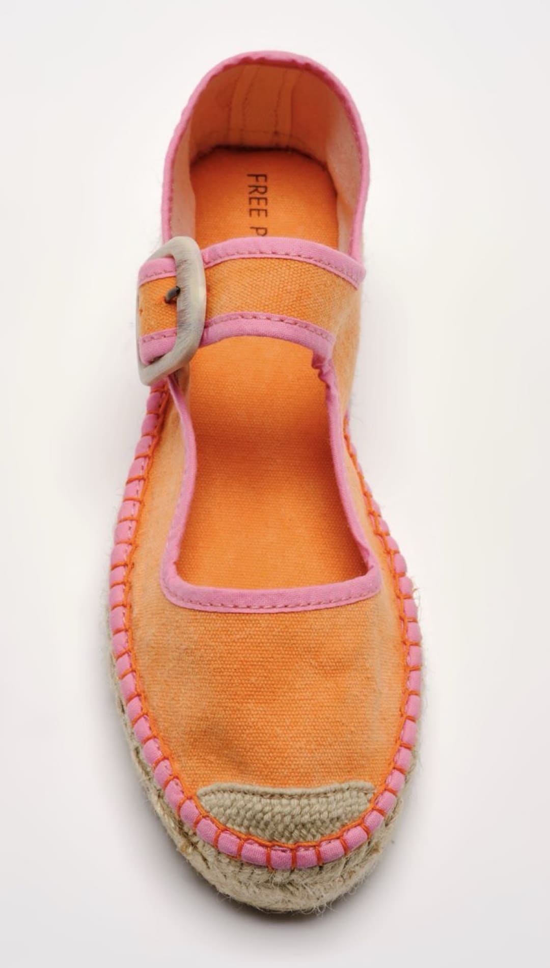 Orange and pink espadrille shoe.