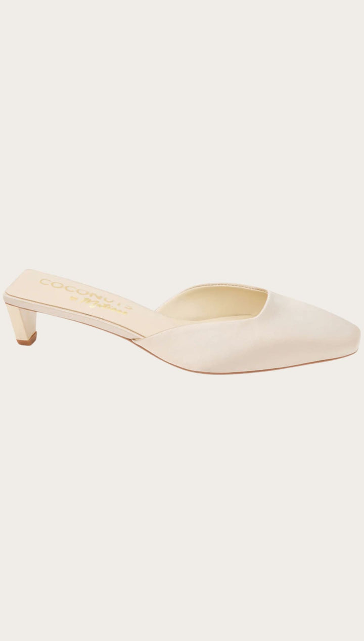 Cream-colored heeled mule.