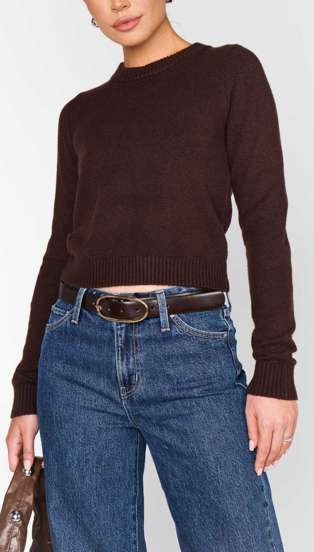 A dark brown crew-neck long-sleeve crop top sweater.