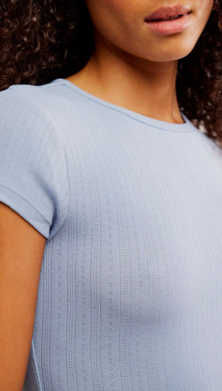 Light blue knit t-shirt.