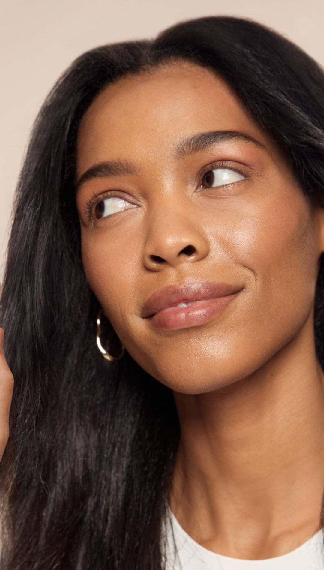 Skintone liquid foundation bottle with pink cap and pump, matte finish.