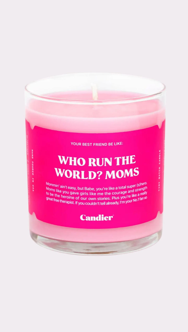 Pink candle in a clear glass jar.