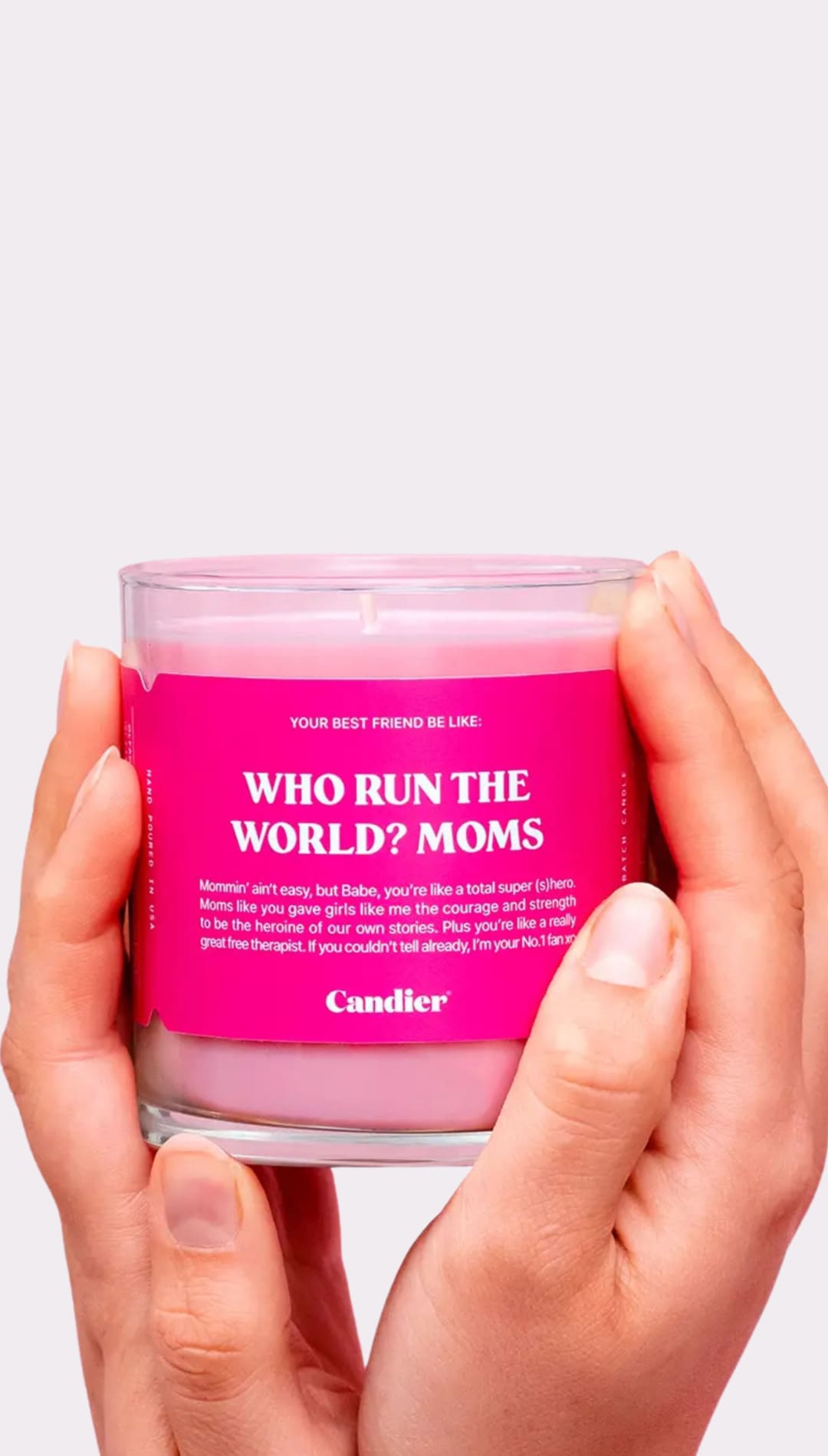 Pink candle in glass jar.