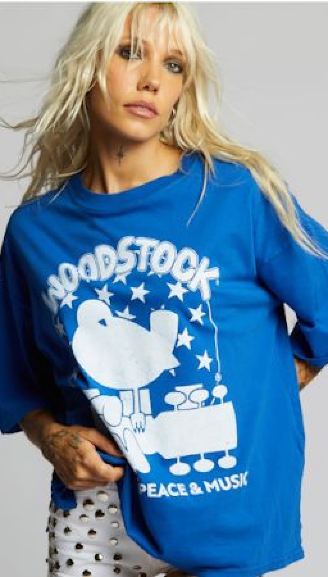 Blue Woodstock graphic t-shirt.