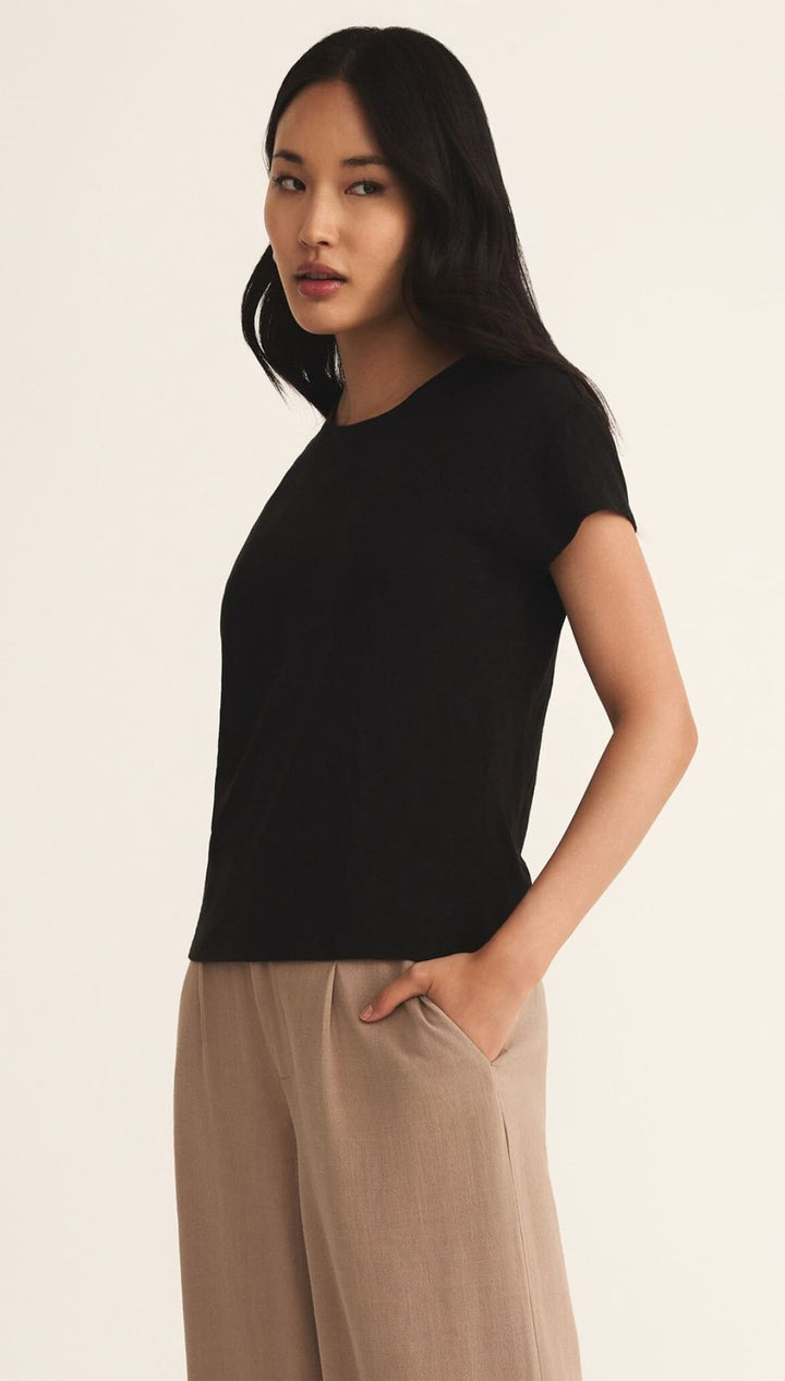Black short-sleeved t-shirt with a relaxed fit and ribbed neckline, likely made of cotton or polyester blend.