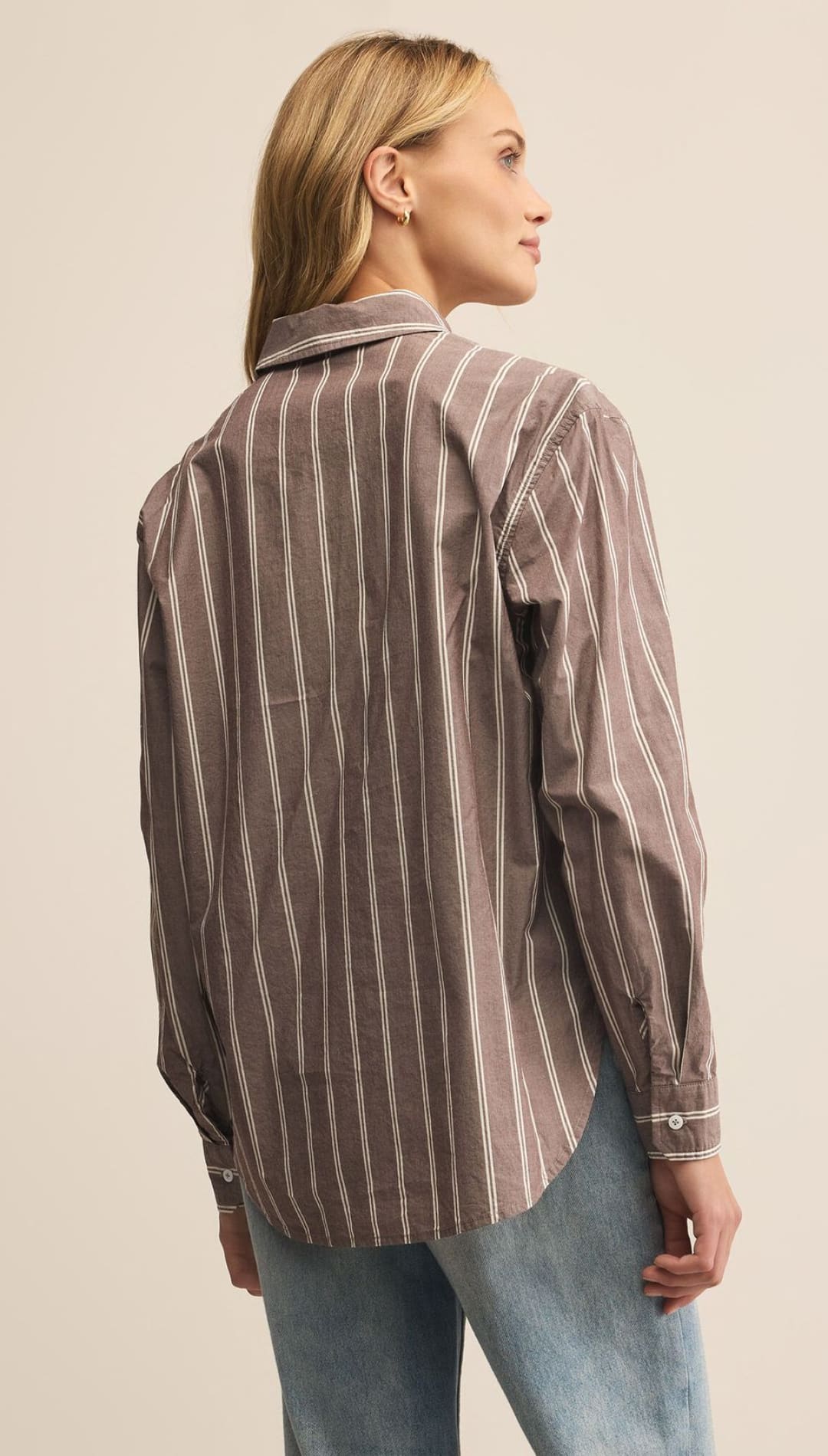 Women’s striped long-sleeve button-up shirt in brown and white.